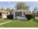 Inviting single-Gathering home with a cozy front porch and a well-kept lawn at 1817 Medford Ave, Indianapolis, IN 46222