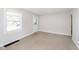 Spacious room with neutral carpet and ample natural light at 1817 Medford Ave, Indianapolis, IN 46222