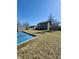 Large backyard with a shed, ample green space, and a protective garden cover at 1934 St James Pl, Columbus, IN 47201