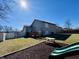 Expansive backyard featuring a picnic table, a slide, and a home exterior at 1934 St James Pl, Columbus, IN 47201