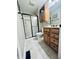 Cozy bathroom featuring a wood vanity, shower, and neutral grey paint at 1934 St James Pl, Columbus, IN 47201