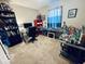 Bedroom featuring desk area, carpet floors, and a window providing natural light, perfect for a hobby room at 1934 St James Pl, Columbus, IN 47201