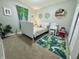Charming bedroom featuring playful decor, carpet flooring, and ample natural light at 1934 St James Pl, Columbus, IN 47201