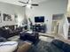 Bright living room features neutral walls, carpet flooring, a modern fireplace, and backyard access at 1934 St James Pl, Columbus, IN 47201