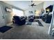 Cozy living room with vaulted ceilings, carpet flooring, comfortable seating, and a modern electric fireplace at 1934 St James Pl, Columbus, IN 47201