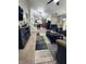 Open-concept living space that flows into the kitchen, featuring neutral paint, carpet, and natural light at 1934 St James Pl, Columbus, IN 47201