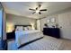 Serene main bedroom with neutral tones, carpet flooring, decorative rug, and sliding barn door at 1934 St James Pl, Columbus, IN 47201