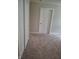 Neutral bedroom showing the carpet and door at 1974 Ralston Ave, Indianapolis, IN 46218