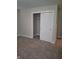 Bedroom with sliding closet door and neutral carpeting at 1974 Ralston Ave, Indianapolis, IN 46218