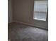 Bedroom with window and grey carpeting at 1974 Ralston Ave, Indianapolis, IN 46218