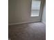 Bedroom with window and neutral carpeting at 1974 Ralston Ave, Indianapolis, IN 46218