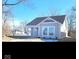 Charming single-story home with gray siding, white trim, and a well-manicured front yard at 1974 Ralston Ave, Indianapolis, IN 46218