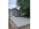 Newly constructed home featuring a concrete back patio and grey siding at 1974 Ralston Ave, Indianapolis, IN 46218
