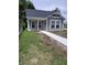 Cozy home exterior with a new concrete walkway and front yard at 1974 Ralston Ave, Indianapolis, IN 46218