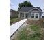 Charming home with a new concrete walkway and freshly landscaped front yard at 1974 Ralston Ave, Indianapolis, IN 46218