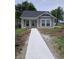 Charming home with a new concrete walkway and freshly landscaped front yard at 1974 Ralston Ave, Indianapolis, IN 46218