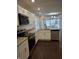 Modern kitchen with stainless steel appliances, white cabinets, and granite countertops at 1974 Ralston Ave, Indianapolis, IN 46218