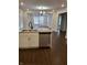 Modern kitchen with stainless steel appliances, granite countertops, and a view of the living room at 1974 Ralston Ave, Indianapolis, IN 46218
