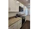 Stylish kitchen with granite counters, stainless steel appliances, and white subway tile backsplash at 1974 Ralston Ave, Indianapolis, IN 46218