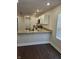 Well-lit kitchen featuring stainless steel appliances, granite countertops, and white cabinets at 1974 Ralston Ave, Indianapolis, IN 46218