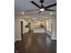 Open floor plan showing the kitchen, dining, and living room with hardwood floors and modern ceiling fan at 1974 Ralston Ave, Indianapolis, IN 46218