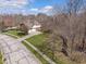 Aerial view of the home's exterior, showcasing its manicured lawn and surrounding trees at 2163 Laurel Leaf Ln, Avon, IN 46123