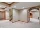 Finished basement featuring architectural details, arches, and neutral color palette at 2163 Laurel Leaf Ln, Avon, IN 46123