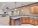 Finished basement bar area boasts a dishwasher, sink, and stylish cabinetry perfect for hosting guests at 2163 Laurel Leaf Ln, Avon, IN 46123