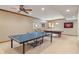 Finished basement features a game room with ping pong table, pool table, and sports decor at 2163 Laurel Leaf Ln, Avon, IN 46123