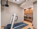 Basement gym area including a treadmill and additional counter space for exercise and fitness at 2163 Laurel Leaf Ln, Avon, IN 46123