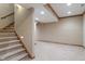 Carpeted basement provides additional living space with stairs and modern lighting at 2163 Laurel Leaf Ln, Avon, IN 46123