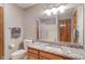 Bathroom featuring a granite countertop and a sink with wood cabinets at 2163 Laurel Leaf Ln, Avon, IN 46123