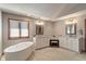 Large bathroom featuring double vanities, and a modern soaking tub at 2163 Laurel Leaf Ln, Avon, IN 46123