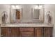 Bathroom features double vanity, granite countertops, framed mirrors, and decorative lighting at 2163 Laurel Leaf Ln, Avon, IN 46123