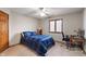 Bedroom offers a ceiling fan, natural light, plush carpet and a built-in study space at 2163 Laurel Leaf Ln, Avon, IN 46123