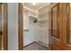 Closet offers custom built-in shelving, drawers, and ample storage space behind wood door at 2163 Laurel Leaf Ln, Avon, IN 46123