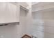 Walk-in closet features custom shelving, storage, and built-in drawers for optimal organization at 2163 Laurel Leaf Ln, Avon, IN 46123