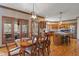 Dining room adjacent to the kitchen with access to the porch and views of the surrounding landscape at 2163 Laurel Leaf Ln, Avon, IN 46123