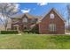 Charming brick two-story home with a manicured lawn and mature landscaping at 2163 Laurel Leaf Ln, Avon, IN 46123