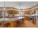 Spacious kitchen with island, granite countertops, stainless appliances, and custom wood cabinetry at 2163 Laurel Leaf Ln, Avon, IN 46123