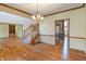 Open living space with hardwood floors, staircase and dining area at 2163 Laurel Leaf Ln, Avon, IN 46123