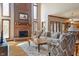 Inviting living room featuring a floor-to-ceiling fireplace, plush seating, and natural light at 2163 Laurel Leaf Ln, Avon, IN 46123