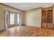 Bright, airy living room with hardwood floors, bay windows, and custom built in cabinetry at 2163 Laurel Leaf Ln, Avon, IN 46123