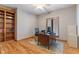 Bright, airy office space featuring hardwood floors, built-in bookshelves, and lots of natural light at 2163 Laurel Leaf Ln, Avon, IN 46123