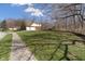 Spacious yard on a corner lot with mature trees and a sidewalk leading to the home at 2163 Laurel Leaf Ln, Avon, IN 46123