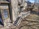 Rear exterior view highlighting a private wooden deck with stairs, perfect for outdoor relaxation and entertaining at 2215 Van Ness Pl, Indianapolis, IN 46240