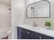 Modern bathroom with a navy blue vanity and an enclosed shower at 2215 Van Ness Pl, Indianapolis, IN 46240