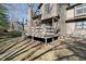 Exterior of home with stairs leading to the deck and backyard at 2215 Van Ness Pl, Indianapolis, IN 46240
