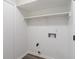 Clean laundry and storage area with shelving and hookups for washer and dryer at 2215 Van Ness Pl, Indianapolis, IN 46240