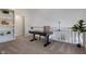 Cozy office space with desk, shelving, and natural light from overlooking stairwell and window at 2215 Van Ness Pl, Indianapolis, IN 46240